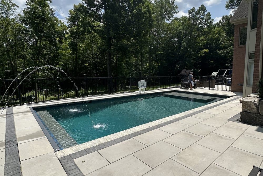 Pool and paved outdoor living area