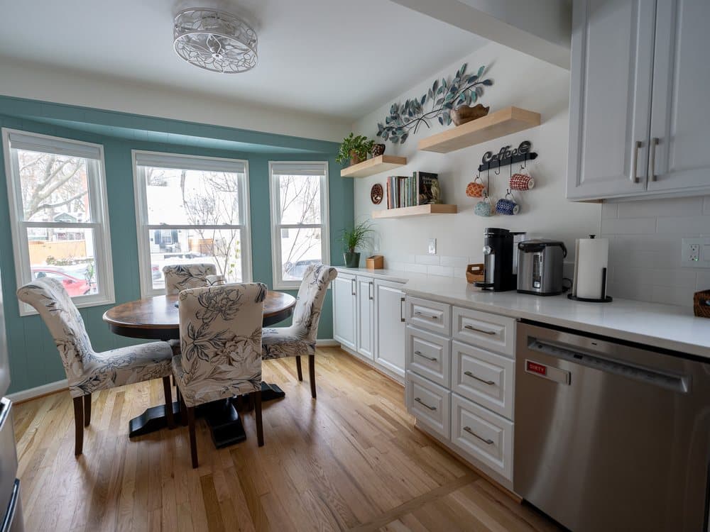 Bright living area with a bay window and shelving